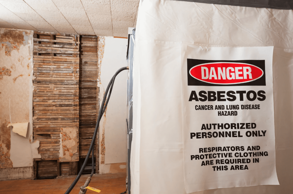 Asbestos warning sign in hazardous building renovation site