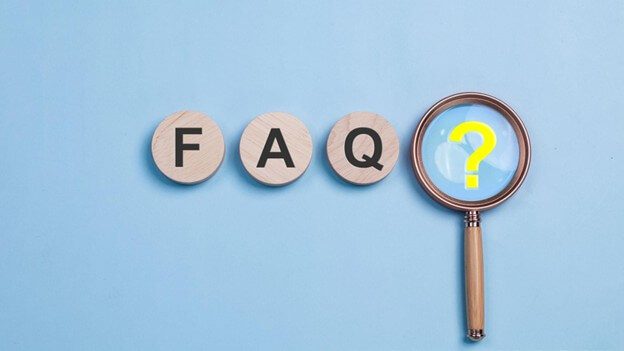 FAQ letters with magnifying glass on question mark