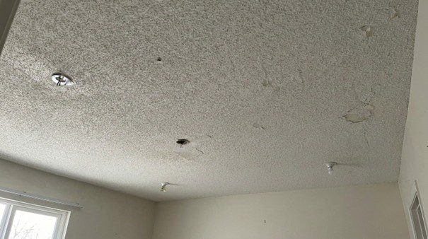 Textured ceiling with missing light bulbs